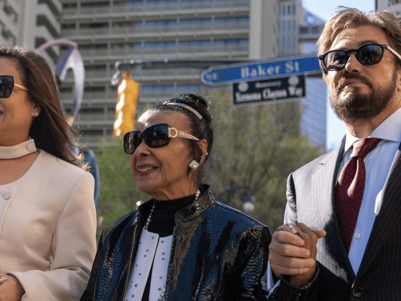 Xernona Clayton (center) and Xernona Clayton Statue Project Co-Creators Mariana Romero (Left) and Rich Baker (right) cross Xernona Clayton Way in Downtown Atlanta, Georgia toward the unveiling of the Xernona Clayton statue on Wednesday, March 8,2023.