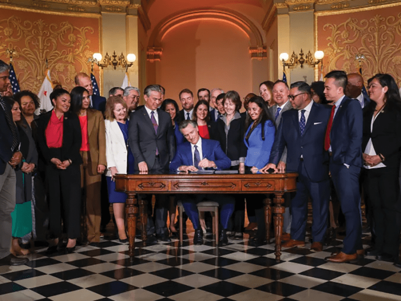 In the rotunda of the California State Capitol, Governor Newsom signs legislation holding Big Oil accountable.