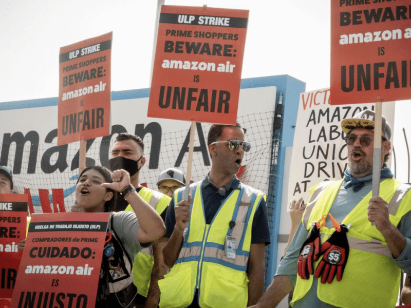 Picketers boo on October 14, 2022 as workers from Amazon KSBD, the Amazon air hub warehouse, speak about the one dollar raise that Amazon workers received after they presented a list of demands to Amazon. Sara Fee, a worker who was speaking, said that after this raise she did not even notice a difference in her check but was taxed more for benefits.