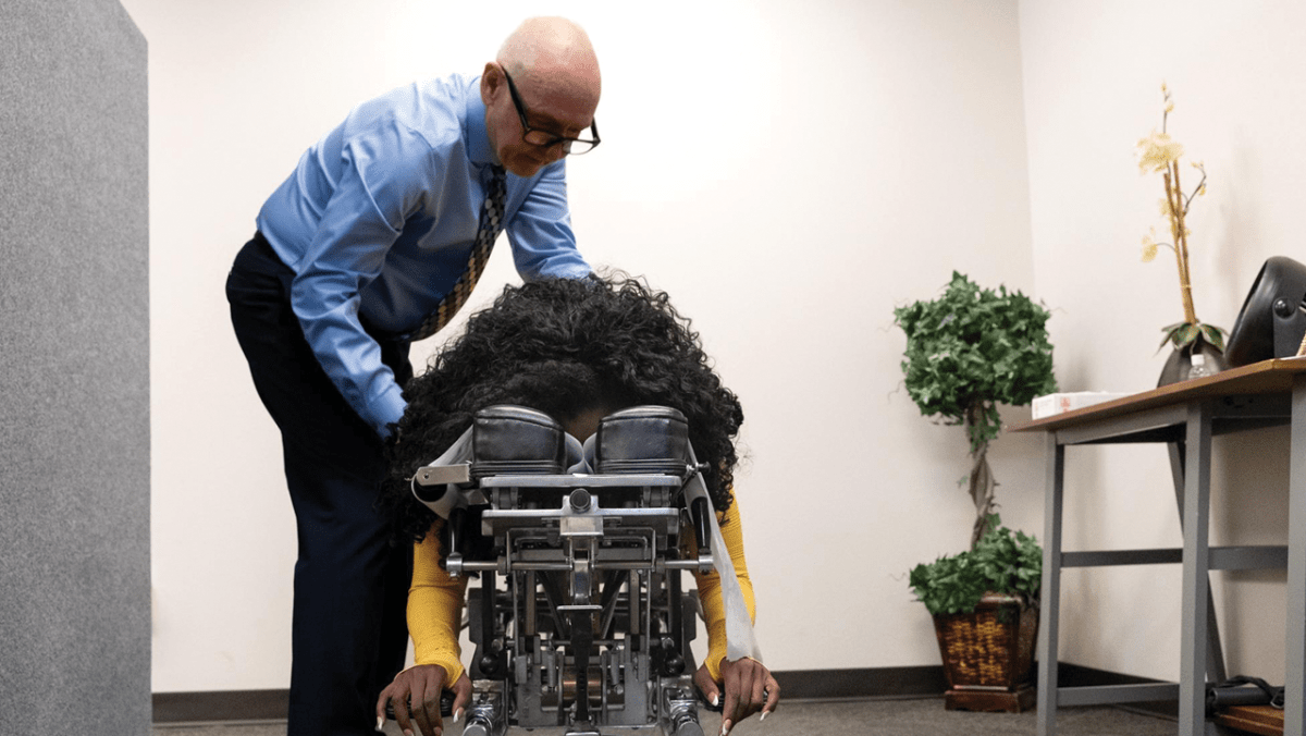 Dr. Shamus Sheridan gives Briana Rice a chiropractic adjustment in his office at Sheridan Chiropractic Inc. in Riverside County on March 22, 2024. In December 2021, Rice, 38, was on her way home from work when she was rear-ended by a semi-truck. She suffered a traumatic brain injury (TBI), a spinal injury and post-traumatic stress disorder (PTSD).