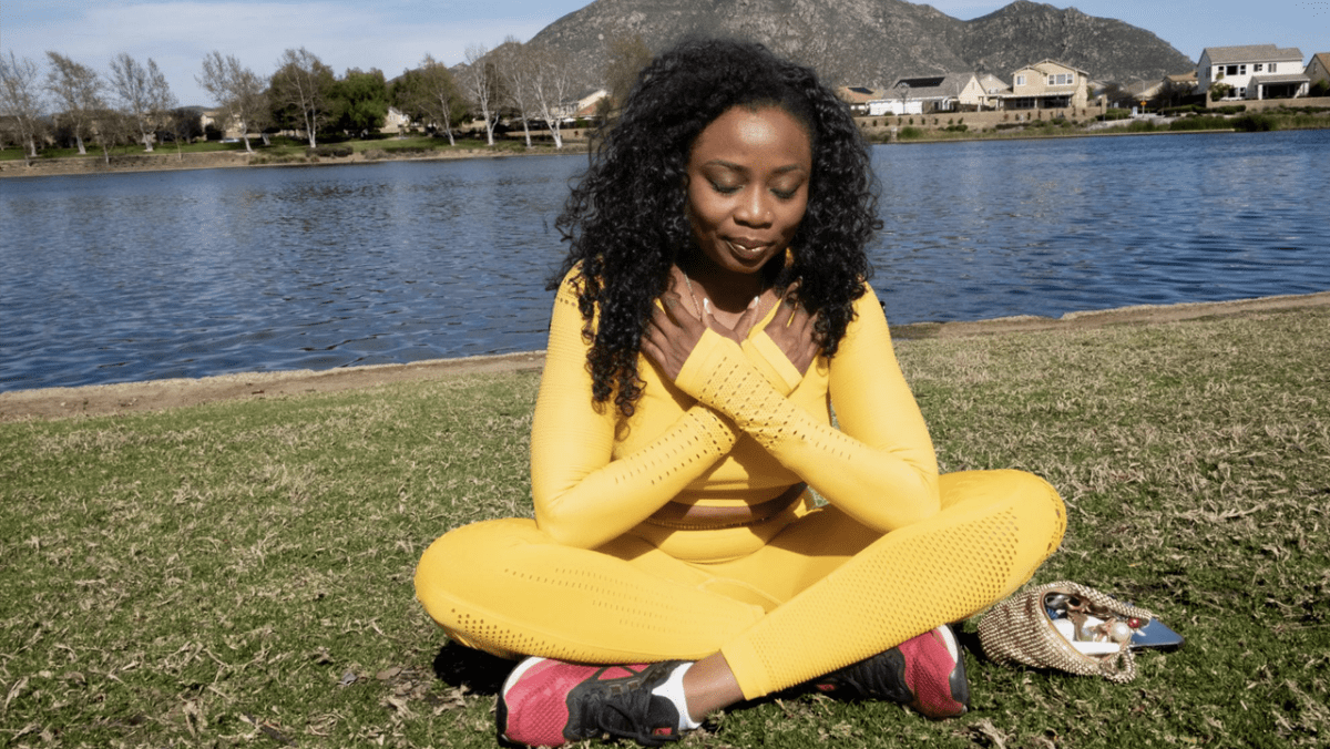 Rice takes a moment of gratitude by the lakeshore on March 22, 2023. Part of her healing process includes walking and practicing meditation outdoors. Rice notices the progress in her physical strength and hopes to soon begin hiking.