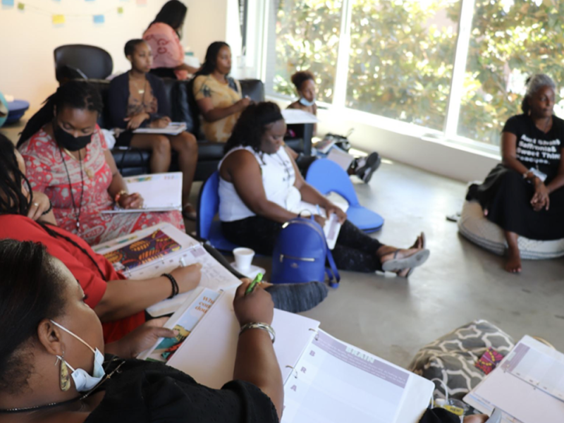 Attendees take notes as they participate in Black Community Doula Training hosted by Riverside Community Health Foundation (RCHF) as part of the Doula Access Program in July 2022. Eleven participants graduated from the training.