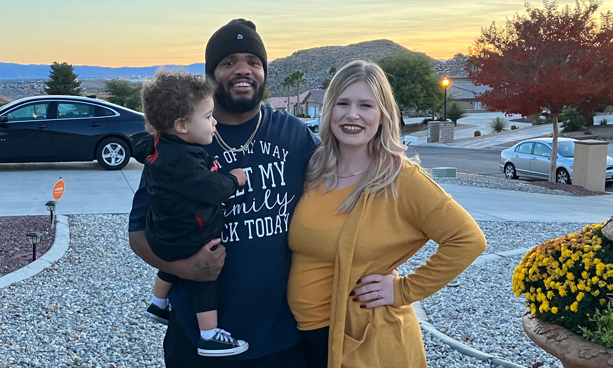 Mia Bloomer and her fiancé, Tim Smith, pose outside Smith’s mother’s house with their son Thaddeus, 1, while daughter Tiara, 6 months, naps inside.