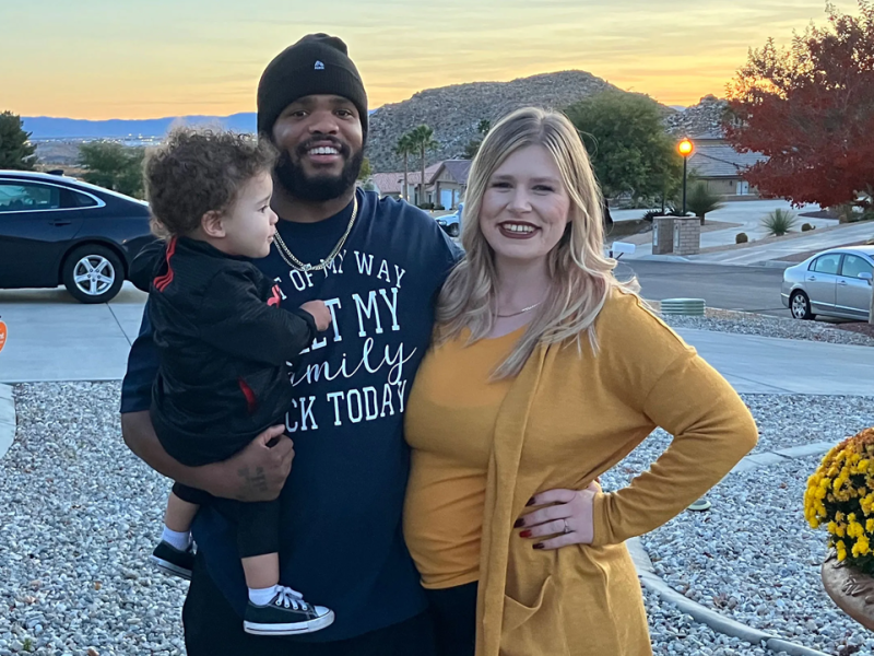 Mia Bloomer and her fiancé, Tim Smith, pose outside Smith’s mother’s house with their son Thaddeus, 1, while daughter Tiara, 6 months, naps inside.