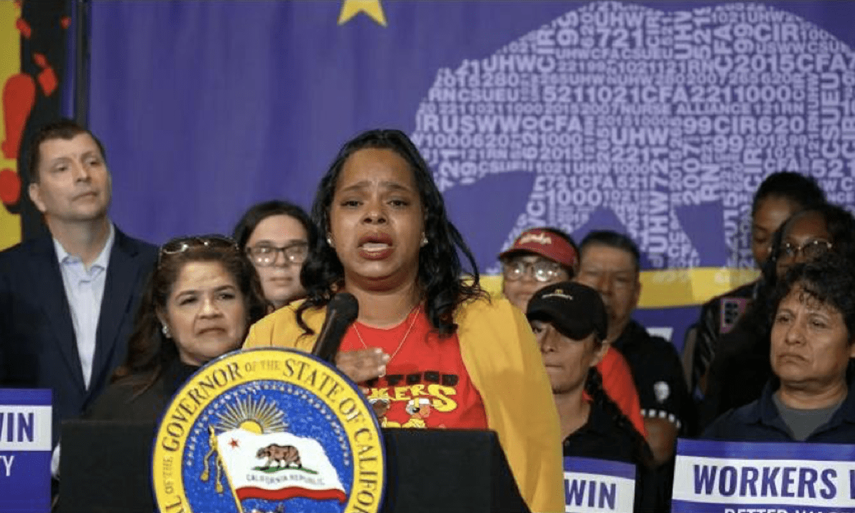 Anneisha Williams gave remarks during a press conference on September 28, 2023, when Governor Gavin Newsom signed into law AB 1228, repealing the FAST Food Accountability and Standards Recovery Act and replacing it with a $20-per-hour minimum wage for fast food workers.