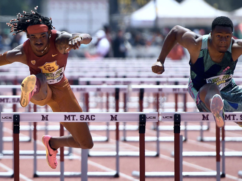 USC's Tade Ojora (right) running for Great Britain, wins the 110 Elite hurdles over teammate Johnnie Brackins in 13.38