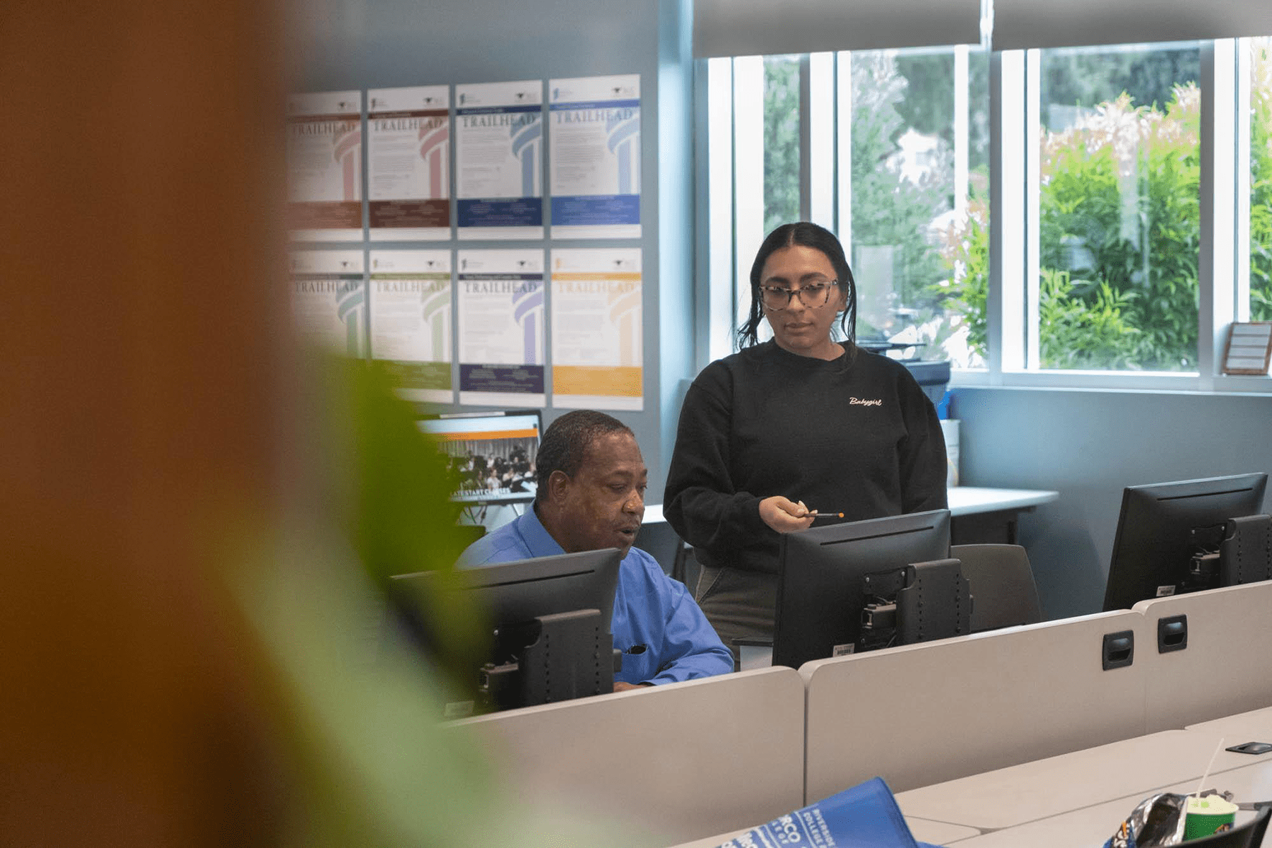 Richard Jerimiah Giles III, 58, works with a computer technician at Riverside Community College for the upcoming semester on April 4, 2024. After serving 28 years in prison he was released in February. He works daily at reintegrating into society by learning new skills and navigating technology.